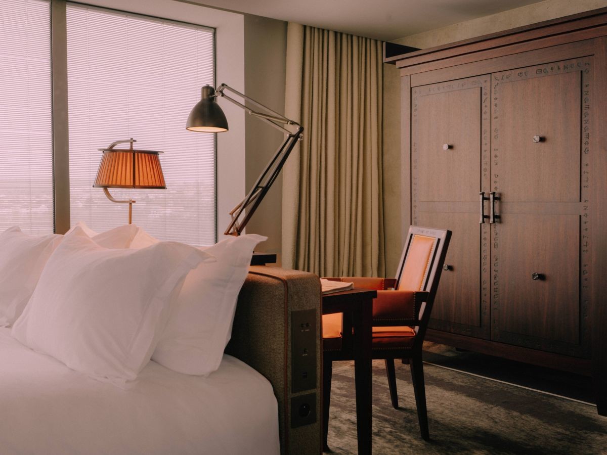 Deluxe bedroom with a dark wood wardrobe