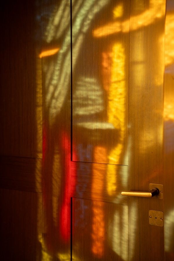 Light play and reflections on wooden door